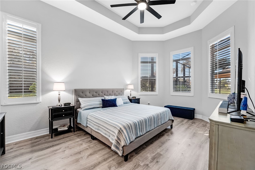 2999 Willow Ridge Court Fort Myers, FL 33905 - Photo 19 of 50 a bedroom with a bed and wooden floor