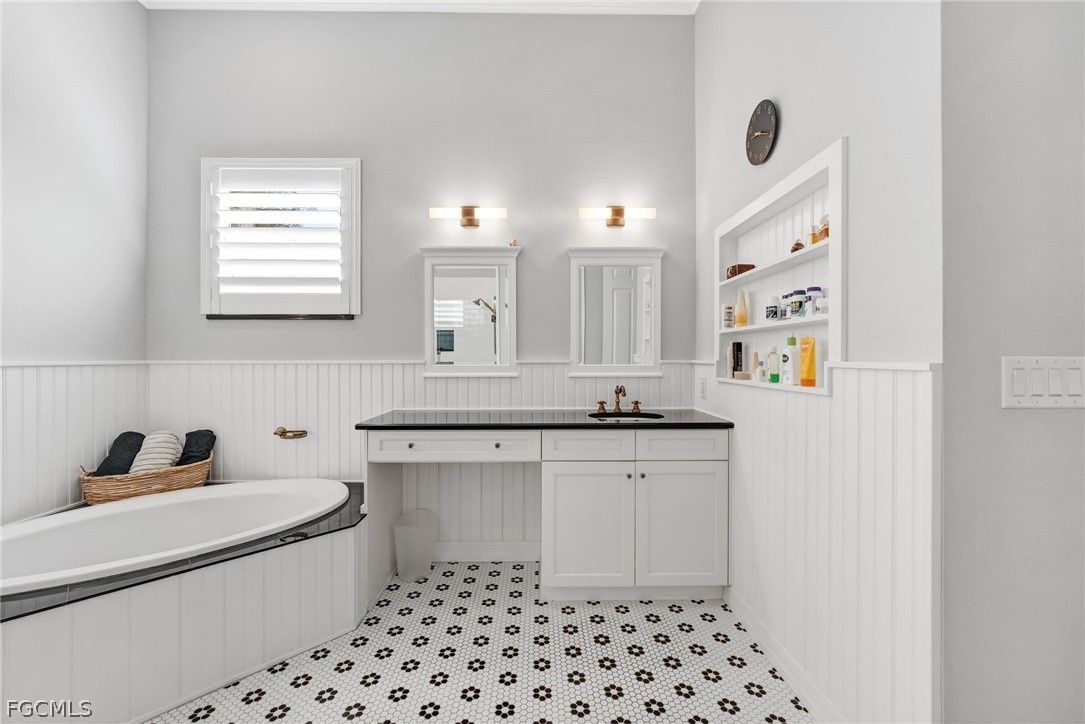2999 Willow Ridge Court Fort Myers, FL 33905 - Photo 22 of 50 a kitchen with a sink a stove and cabinets