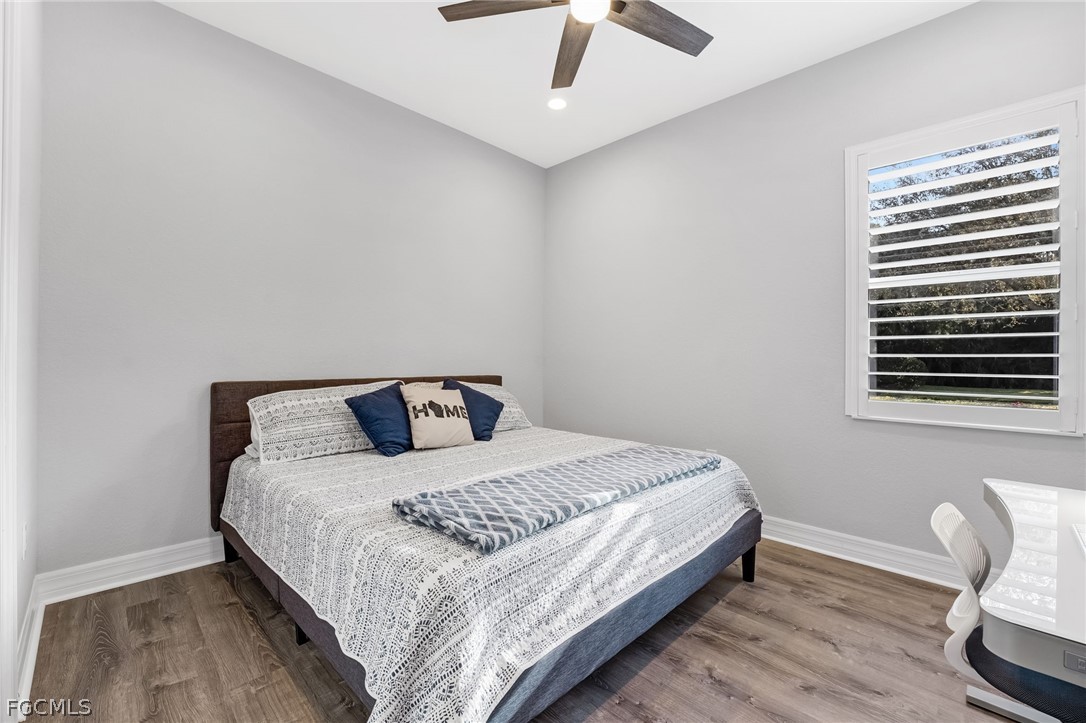 2999 Willow Ridge Court Fort Myers, FL 33905 - Photo 24 of 50 a large bed sitting in a bedroom next to a window
