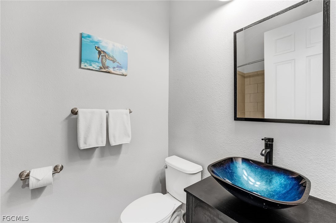 2999 Willow Ridge Court Fort Myers, FL 33905 - Photo 28 of 50 a bathroom with a toilet and a sink