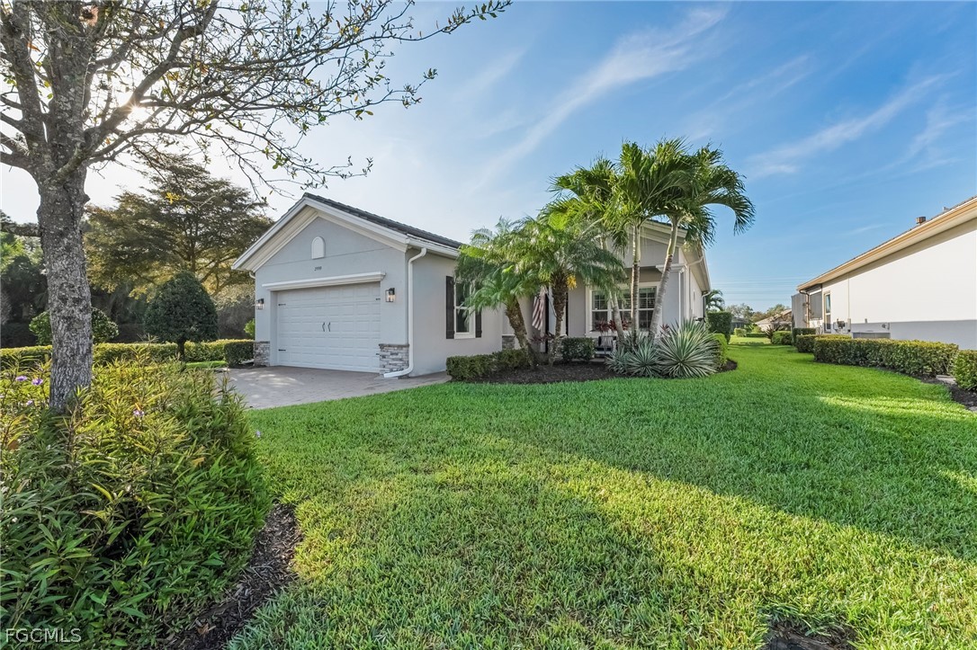 2999 Willow Ridge Court Fort Myers, FL 33905 - Photo 32 of 50 a front view of house with yard and green space