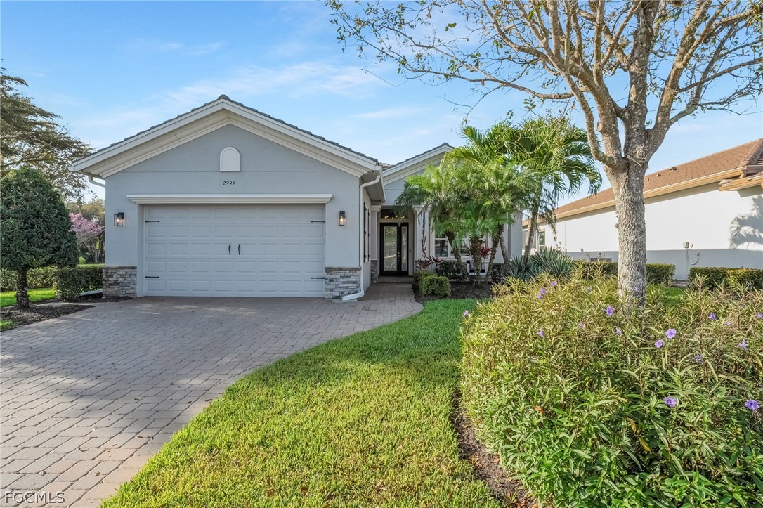 2999 Willow Ridge Court Fort Myers, FL 33905 - Photo 33 of 50 a front view of a house with a yard