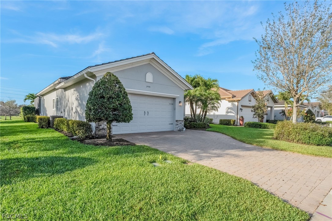 2999 Willow Ridge Court Fort Myers, FL 33905 - Photo 35 of 50 a front view of a house with garden