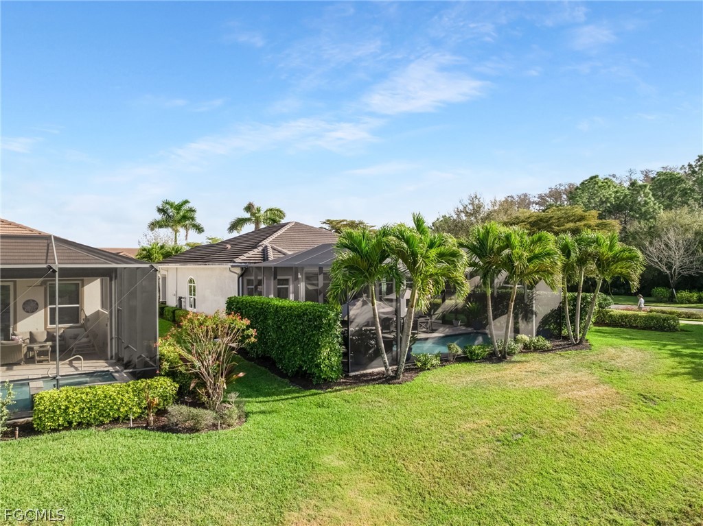 2999 Willow Ridge Court Fort Myers, FL 33905 - Photo 36 of 50 a view of a backyard with a garden and plants