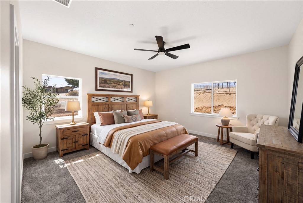 22324 Rancho Street Apple Valley, CA 92308 - Photo 5 of 47 a bed room with a bed and furniture