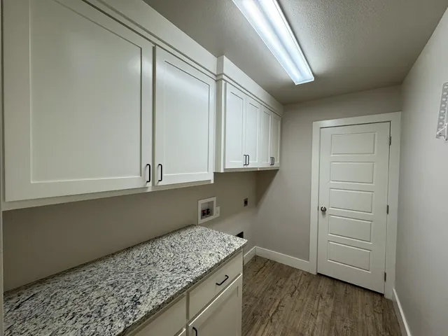 a view of kitchen with wooden floor and staircase