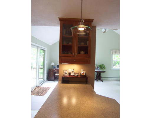 2 Parker Road Ashland, MA 01721 - Photo 11 of 29 a bedroom with a bed and a chandelier