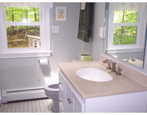 2 Parker Road Ashland, MA 01721 - Photo 19 of 29 a bathroom with a sink a toilet and a window