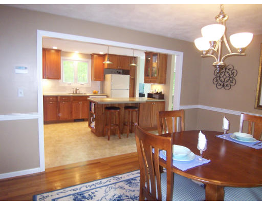 2 Parker Road Ashland, MA 01721 - Photo 5 of 29 a view of a dining room with furniture a chandelier and wooden floor