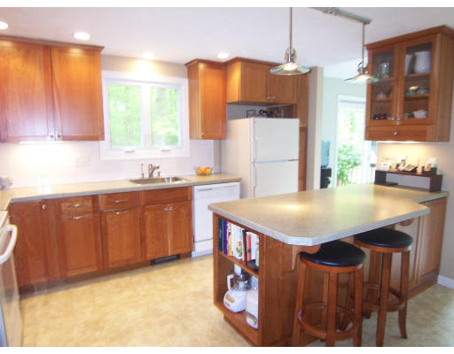 2 Parker Road Ashland, MA 01721 - Photo 6 of 29 a kitchen with a sink a counter top space and cabinets