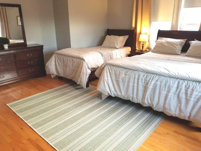 a bathroom with a sink a toilet and a shower curtain