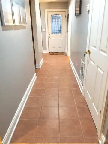 a view of staircase with large windows