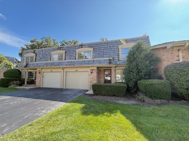 19W147 Ave Rue Royal Oak Brook, IL 60523 - Photo 1 of 16 a front view of a house with a yard