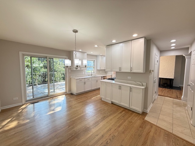 19W147 Ave Rue Royal Oak Brook, IL 60523 - Photo 6 of 16 a large kitchen with a lot of counter space and a wooden floor