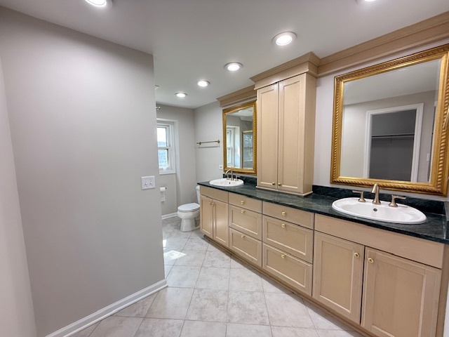 19W147 Ave Rue Royal Oak Brook, IL 60523 - Photo 9 of 16 a bathroom with a double vanity sink and a mirror