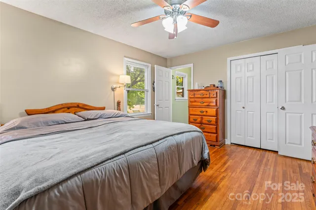 a bedroom with a bed and dresser