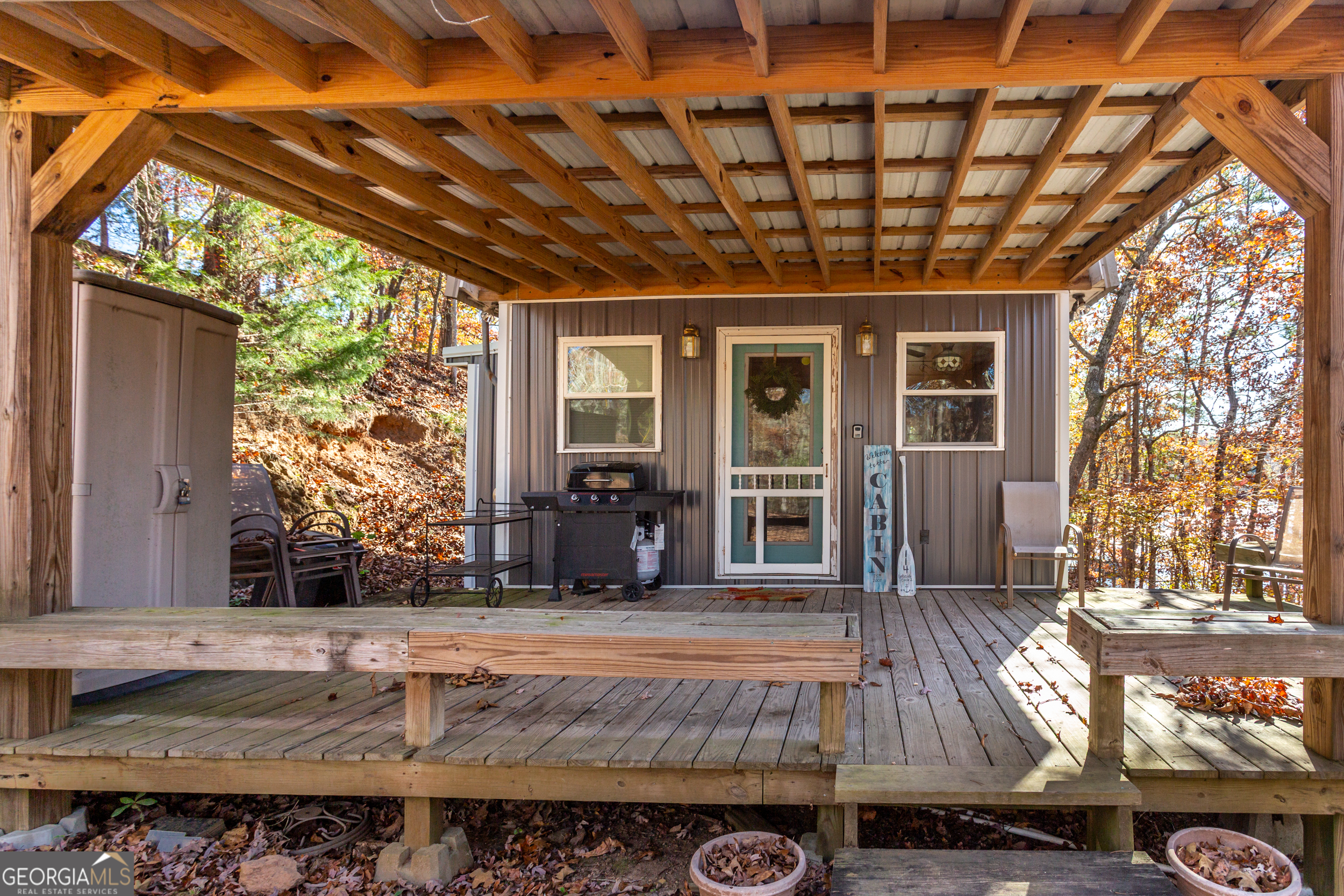 114 Lakeside Circle Delta, AL 36258 - Photo 15 of 22 a view of a porch with furniture and next to a yard