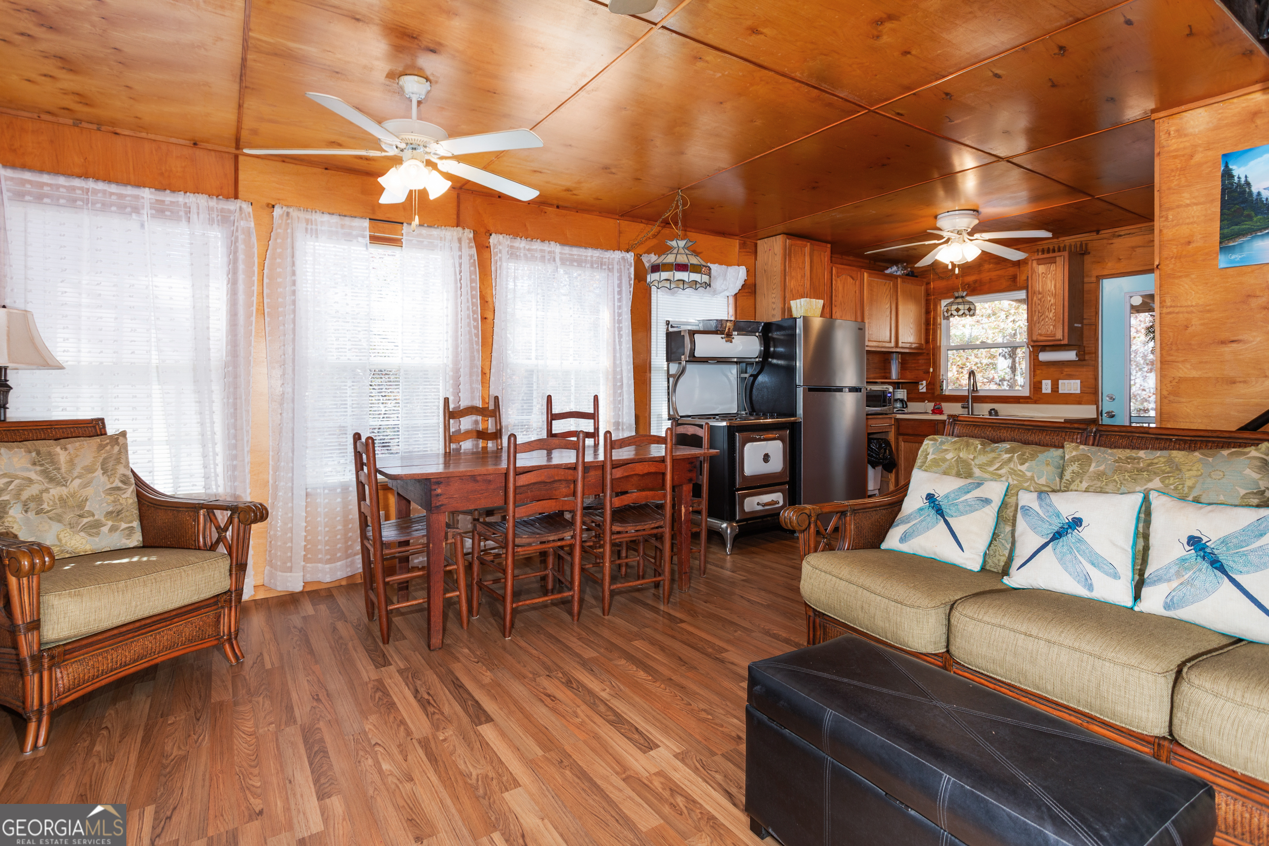 114 Lakeside Circle Delta, AL 36258 - Photo 6 of 22 a dining room with furniture a chandelier and wooden floor