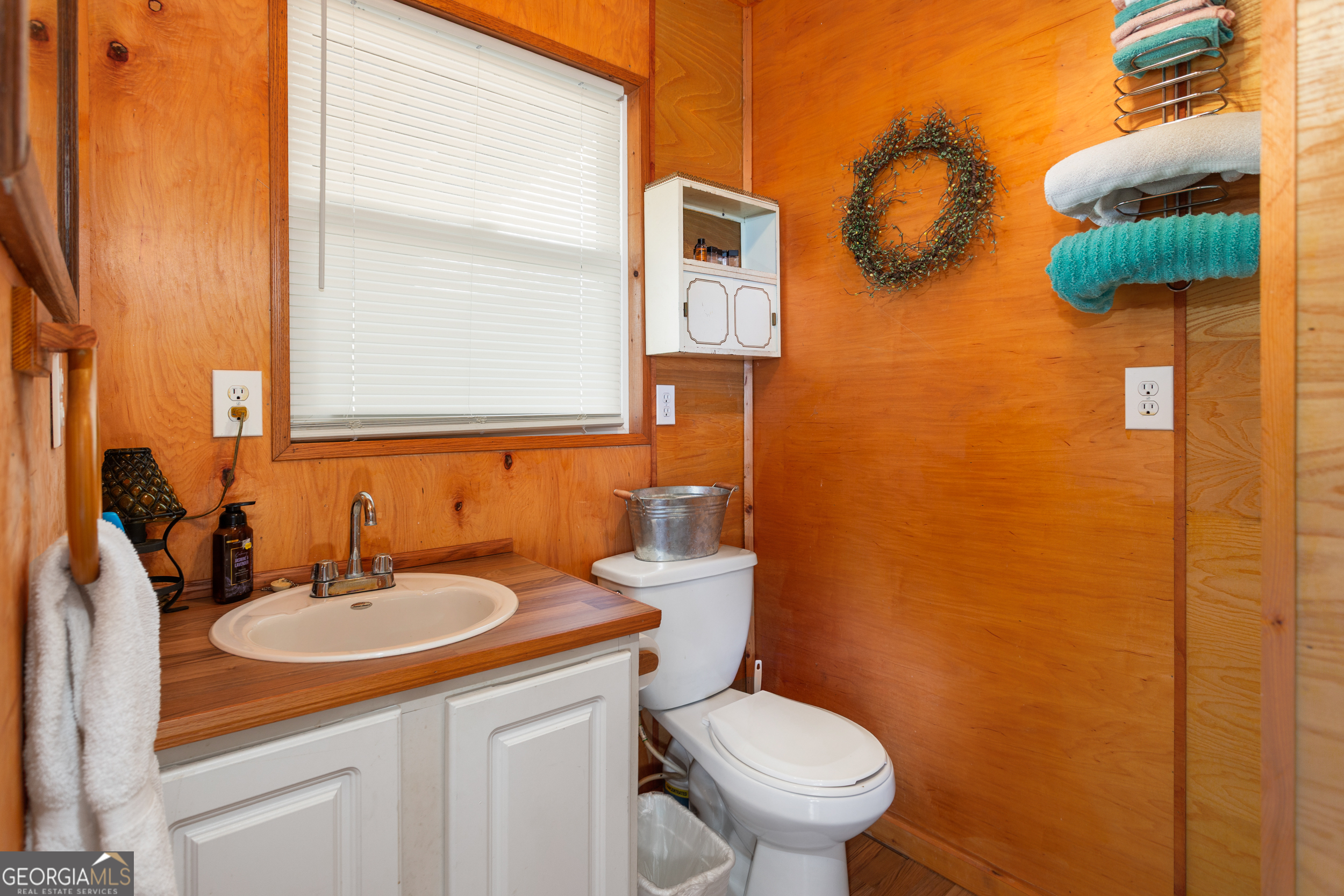 114 Lakeside Circle Delta, AL 36258 - Photo 9 of 22 a bathroom with a sink a toilet and mirror