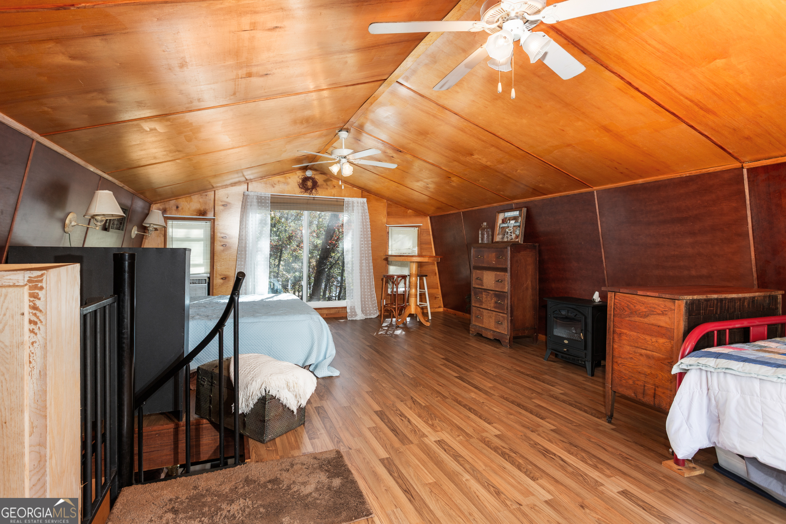 114 Lakeside Circle Delta, AL 36258 - Photo 10 of 22 a living room with furniture a flat screen tv and a refrigerator