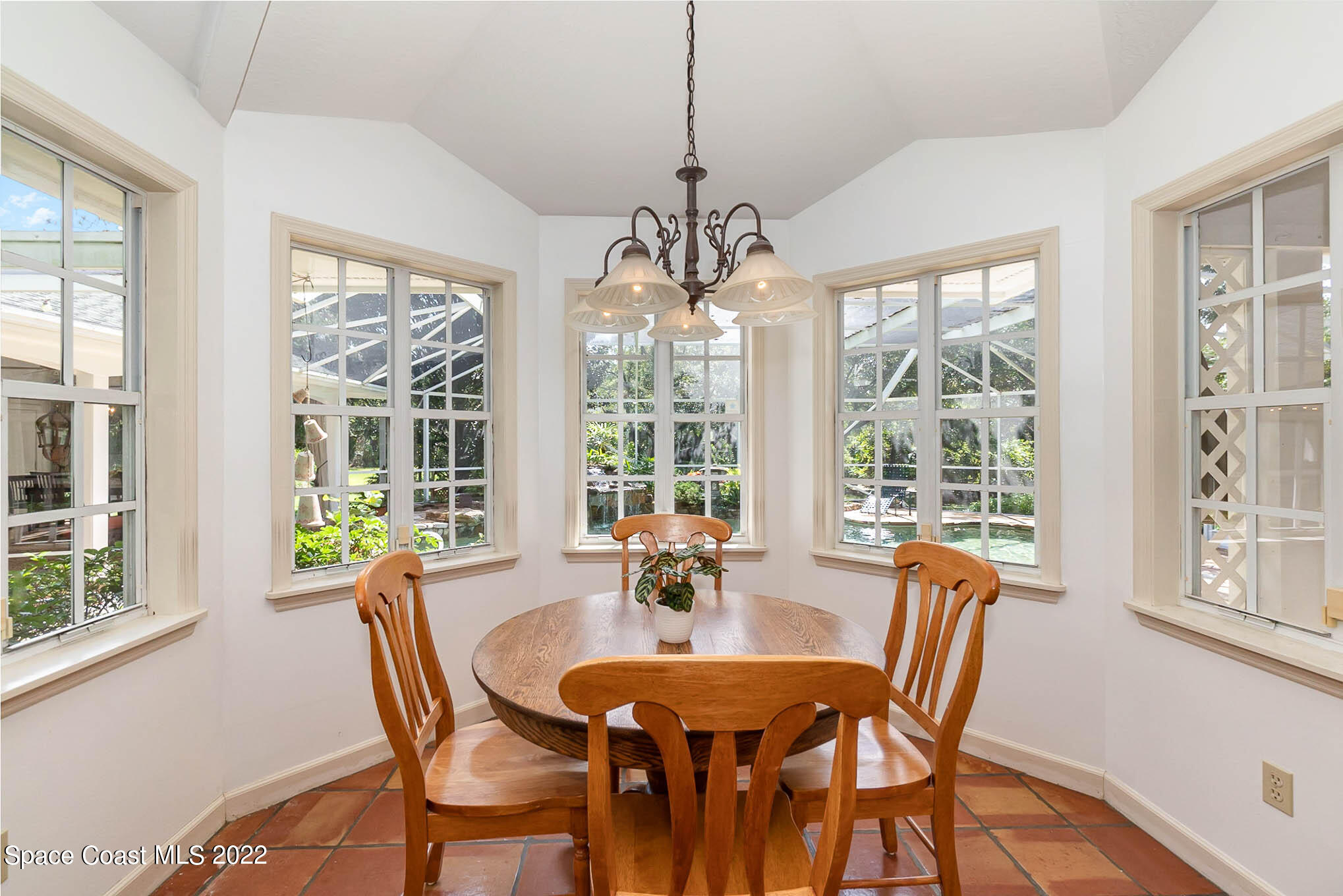 4025 Turtle Mound Road Melbourne, FL 32934 - Photo 14 of 54 a view of a dining room with furniture window and outside view
