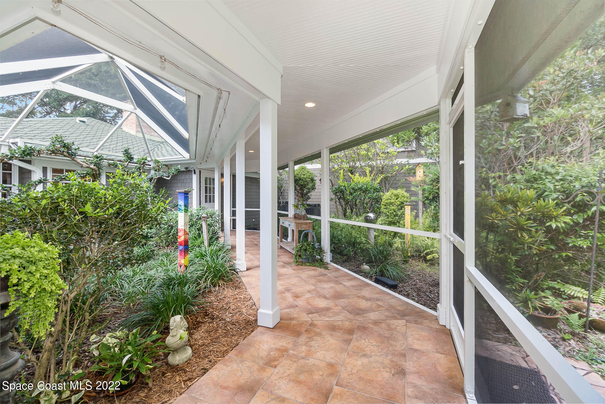 4025 Turtle Mound Road Melbourne, FL 32934 - Photo 19 of 54 a view of a garden from a balcony