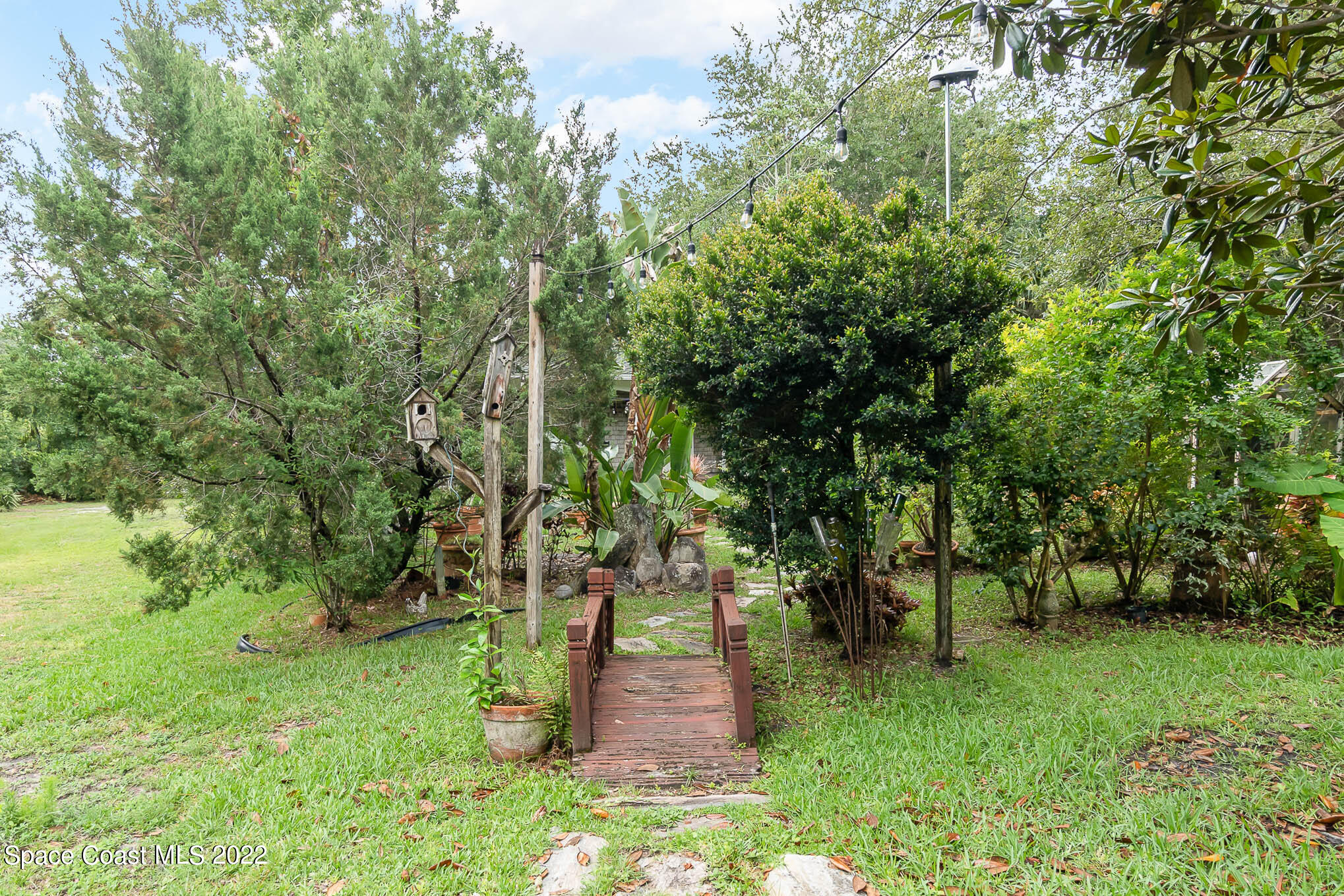 4025 Turtle Mound Road Melbourne, FL 32934 - Photo 25 of 54 a view of a park with large trees
