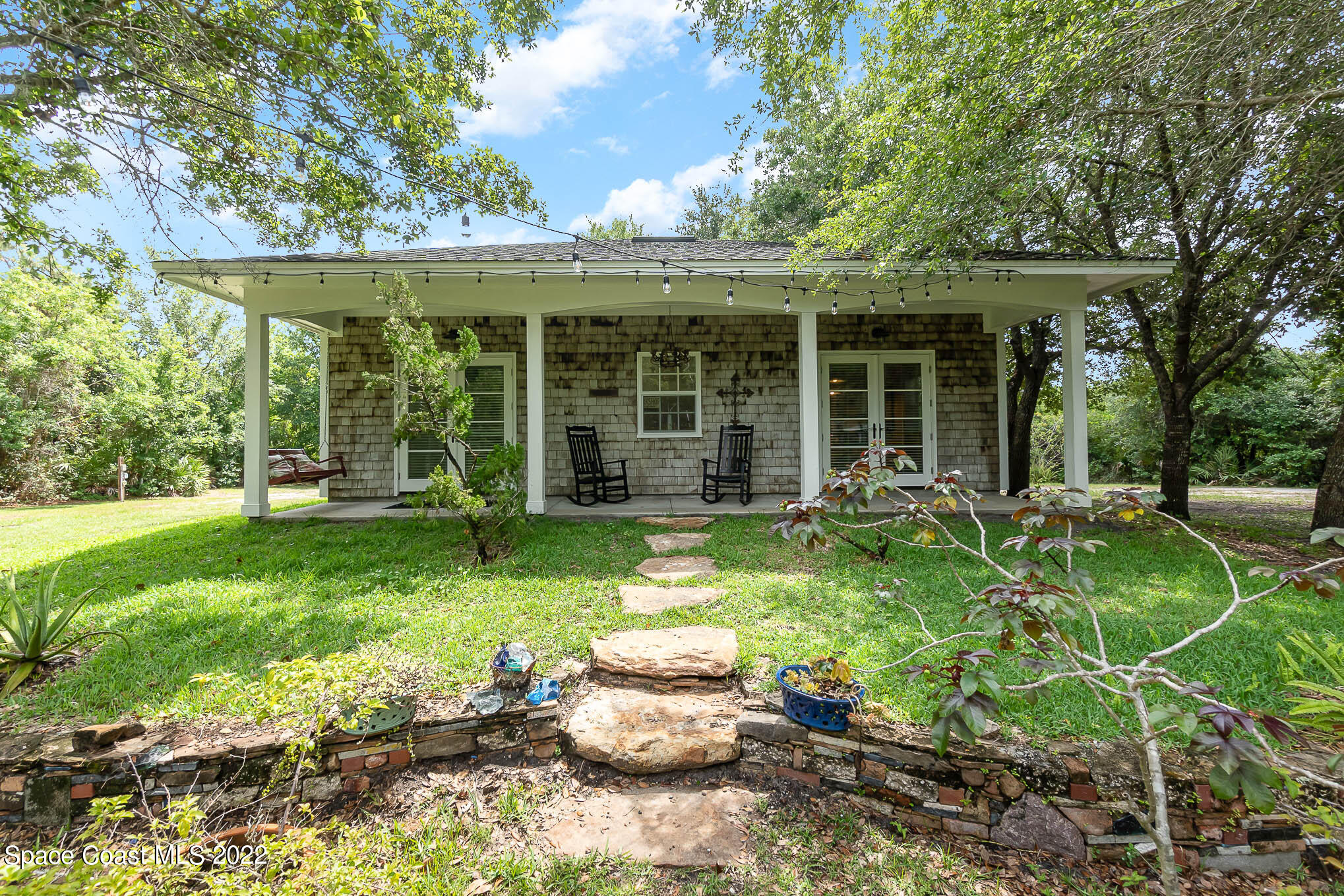 4025 Turtle Mound Road Melbourne, FL 32934 - Photo 26 of 54 front view of a house with a yard