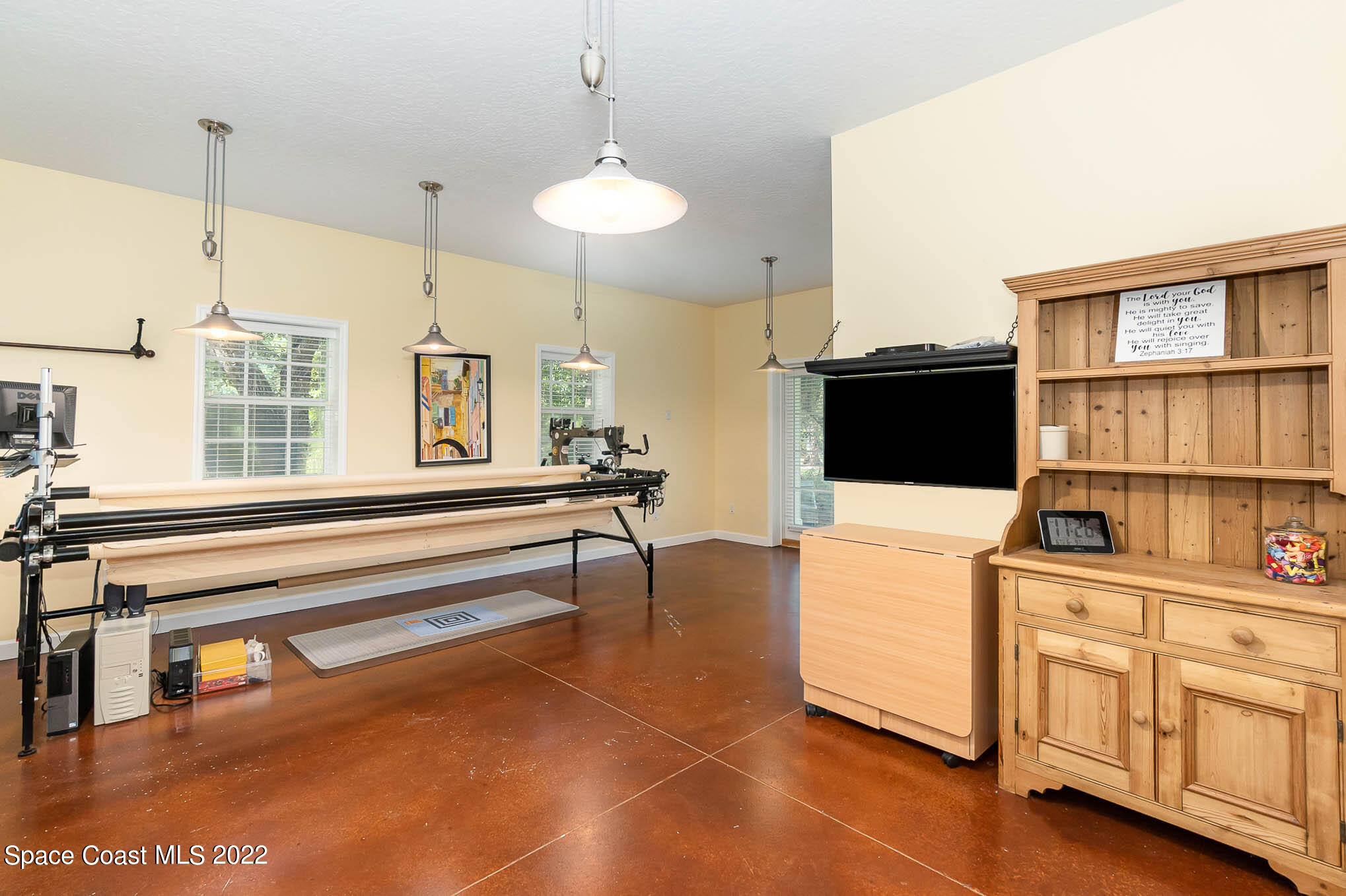 4025 Turtle Mound Road Melbourne, FL 32934 - Photo 29 of 54 a living room with stainless steel appliances kitchen island granite countertop a sink a stove and a wooden floors