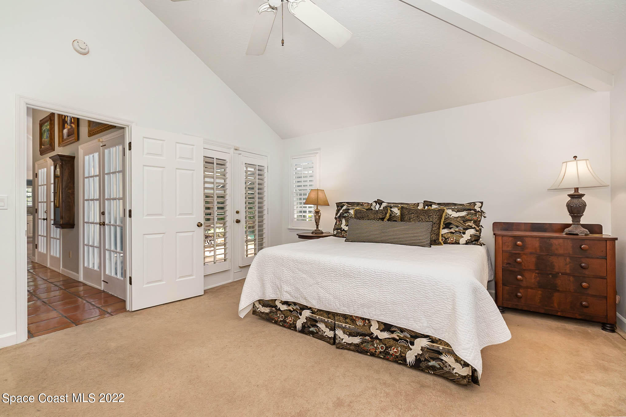4025 Turtle Mound Road Melbourne, FL 32934 - Photo 31 of 54 a spacious bedroom with a bed and dresser