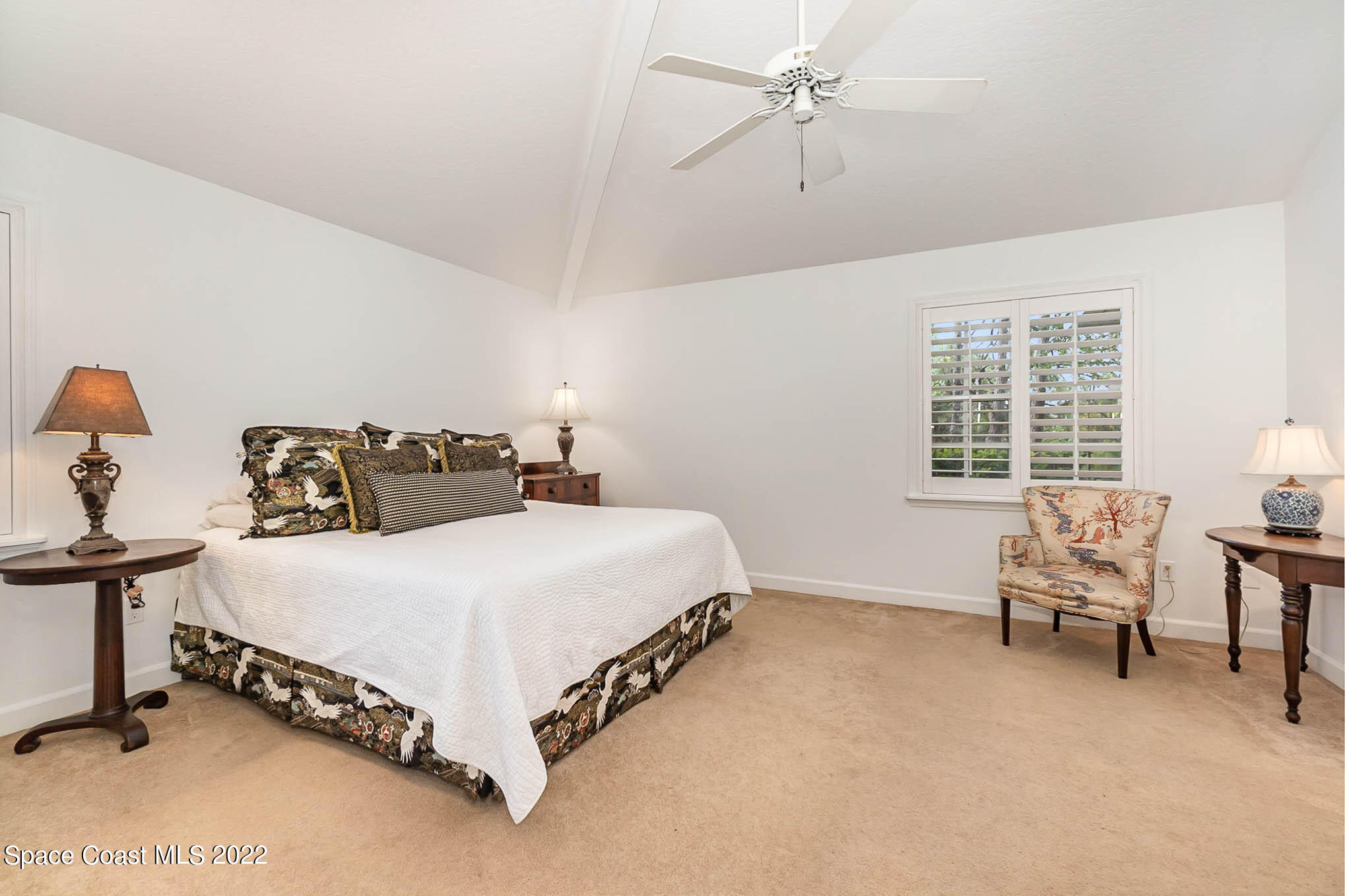 4025 Turtle Mound Road Melbourne, FL 32934 - Photo 32 of 54 a bed sitting in a bedroom next to a window