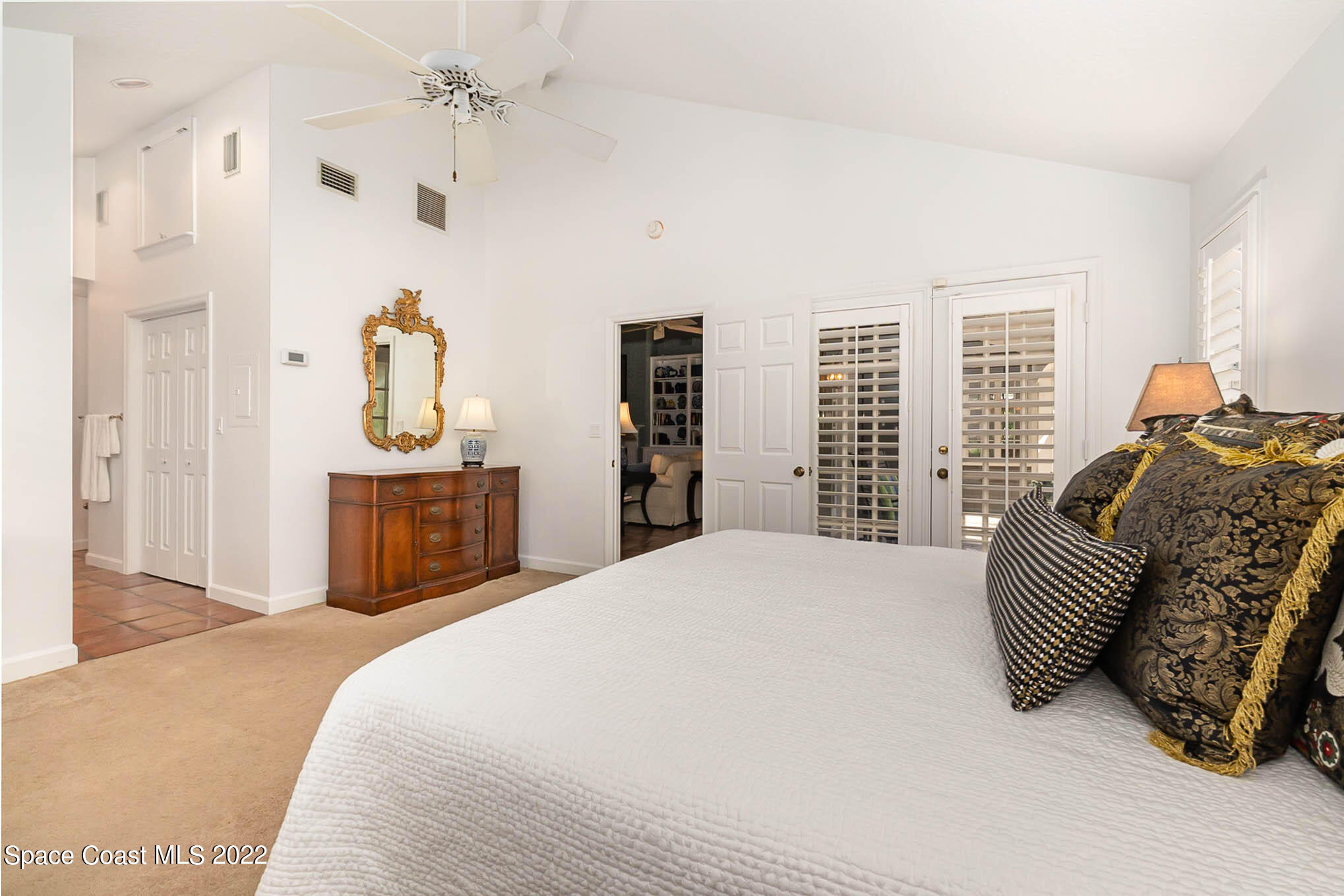 4025 Turtle Mound Road Melbourne, FL 32934 - Photo 33 of 54 a spacious bedroom with a bed and a cabinets