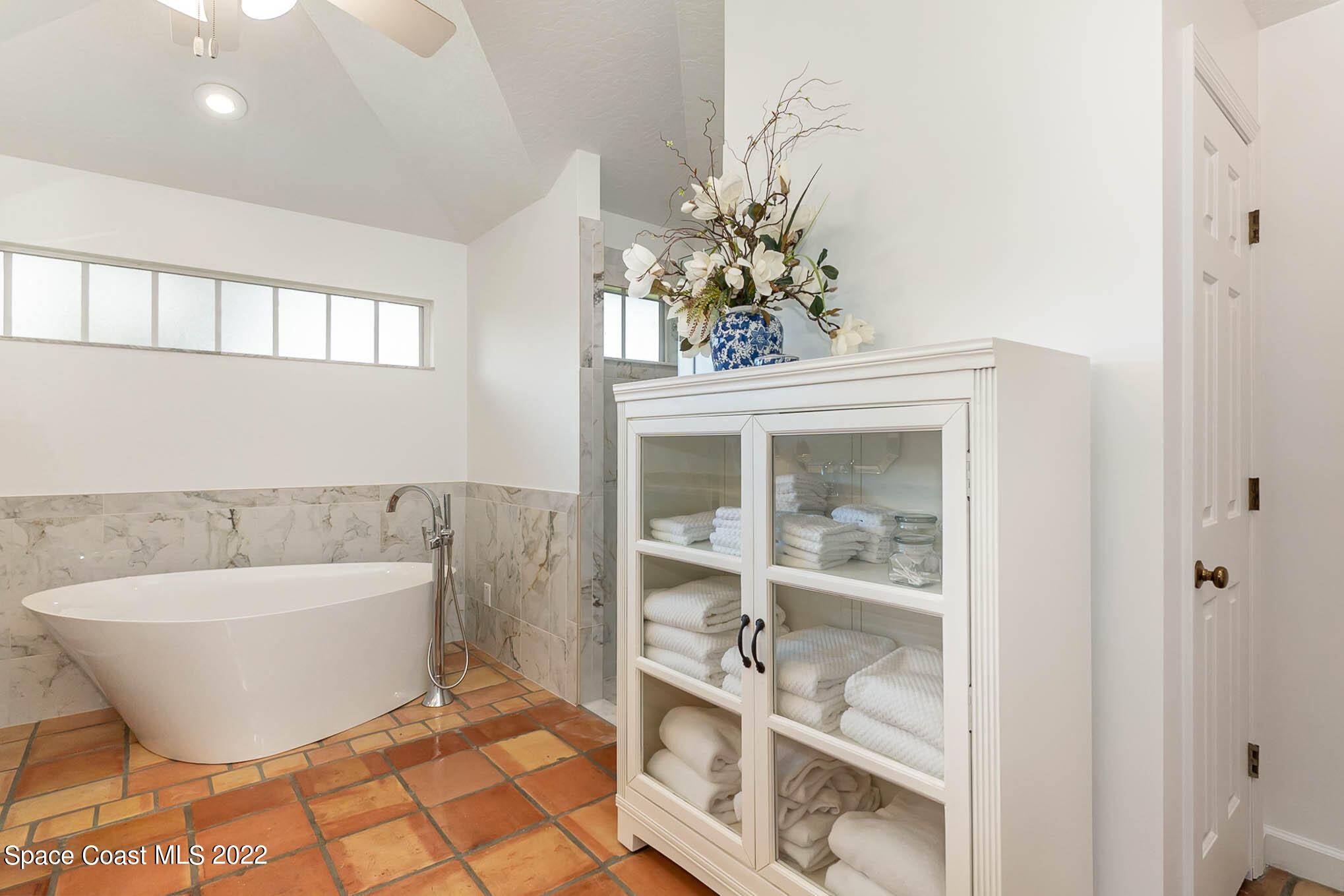 4025 Turtle Mound Road Melbourne, FL 32934 - Photo 35 of 54 a bathroom with a bathtub and shower