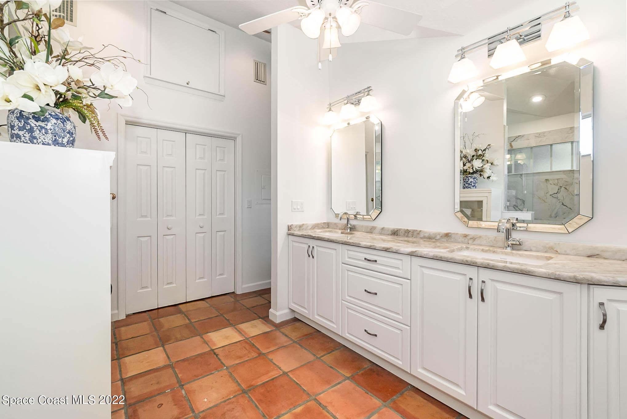 4025 Turtle Mound Road Melbourne, FL 32934 - Photo 37 of 54 a bathroom with a granite countertop sink and a mirror