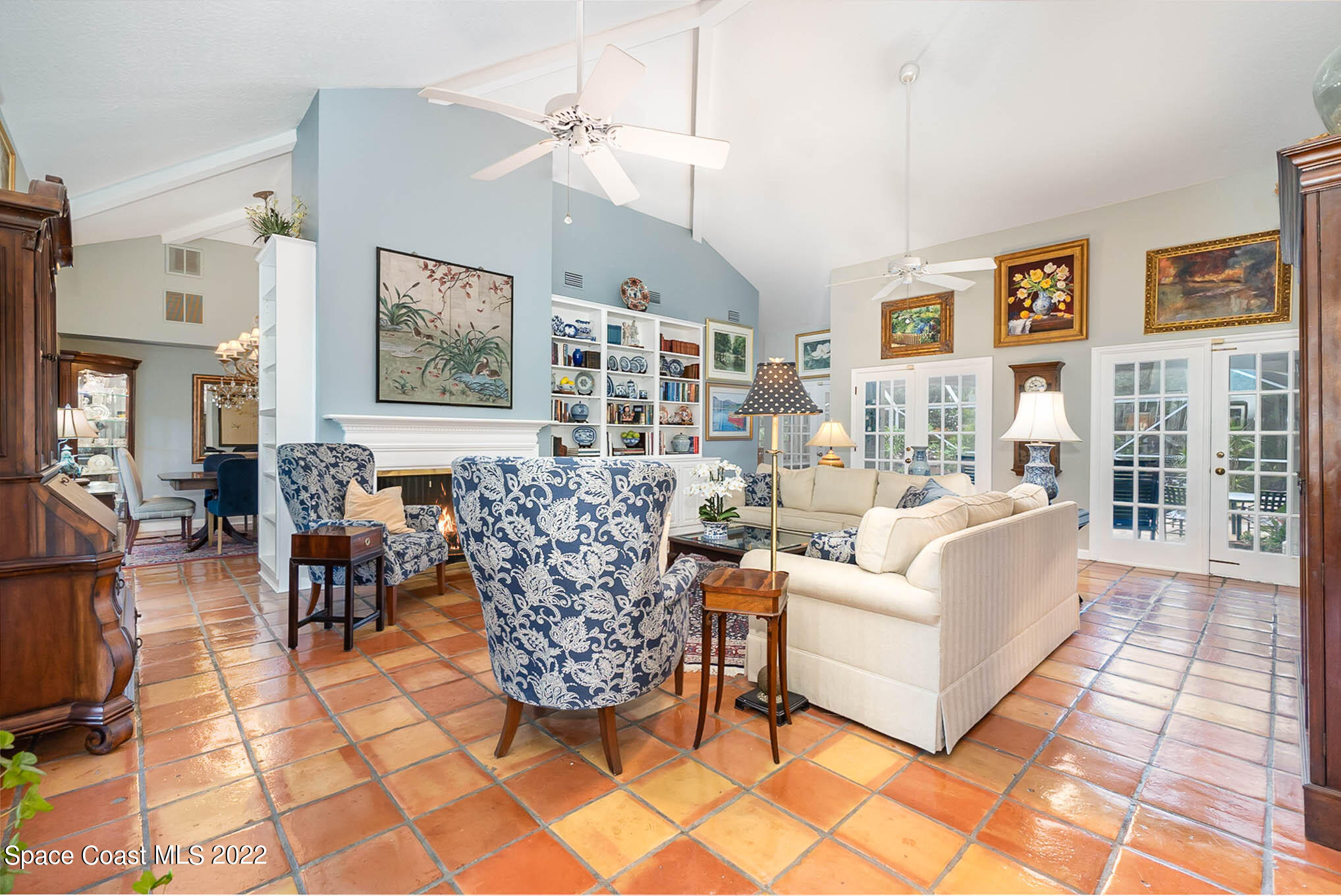4025 Turtle Mound Road Melbourne, FL 32934 - Photo 4 of 54 a living room with furniture and a floor to ceiling window