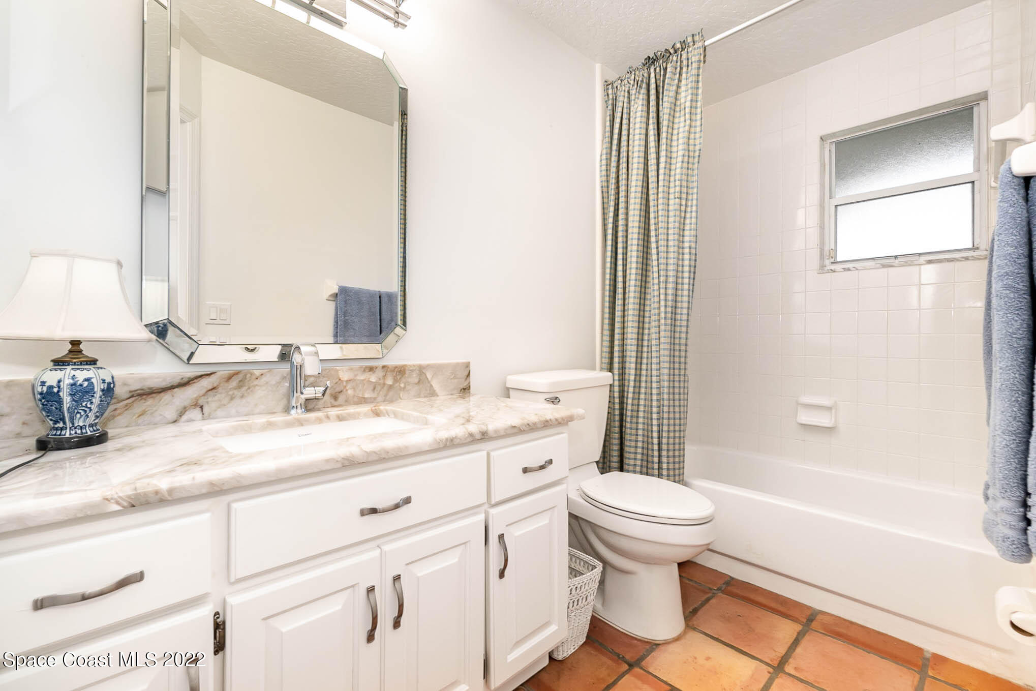 4025 Turtle Mound Road Melbourne, FL 32934 - Photo 41 of 54 a bathroom with a granite countertop sink toilet and shower