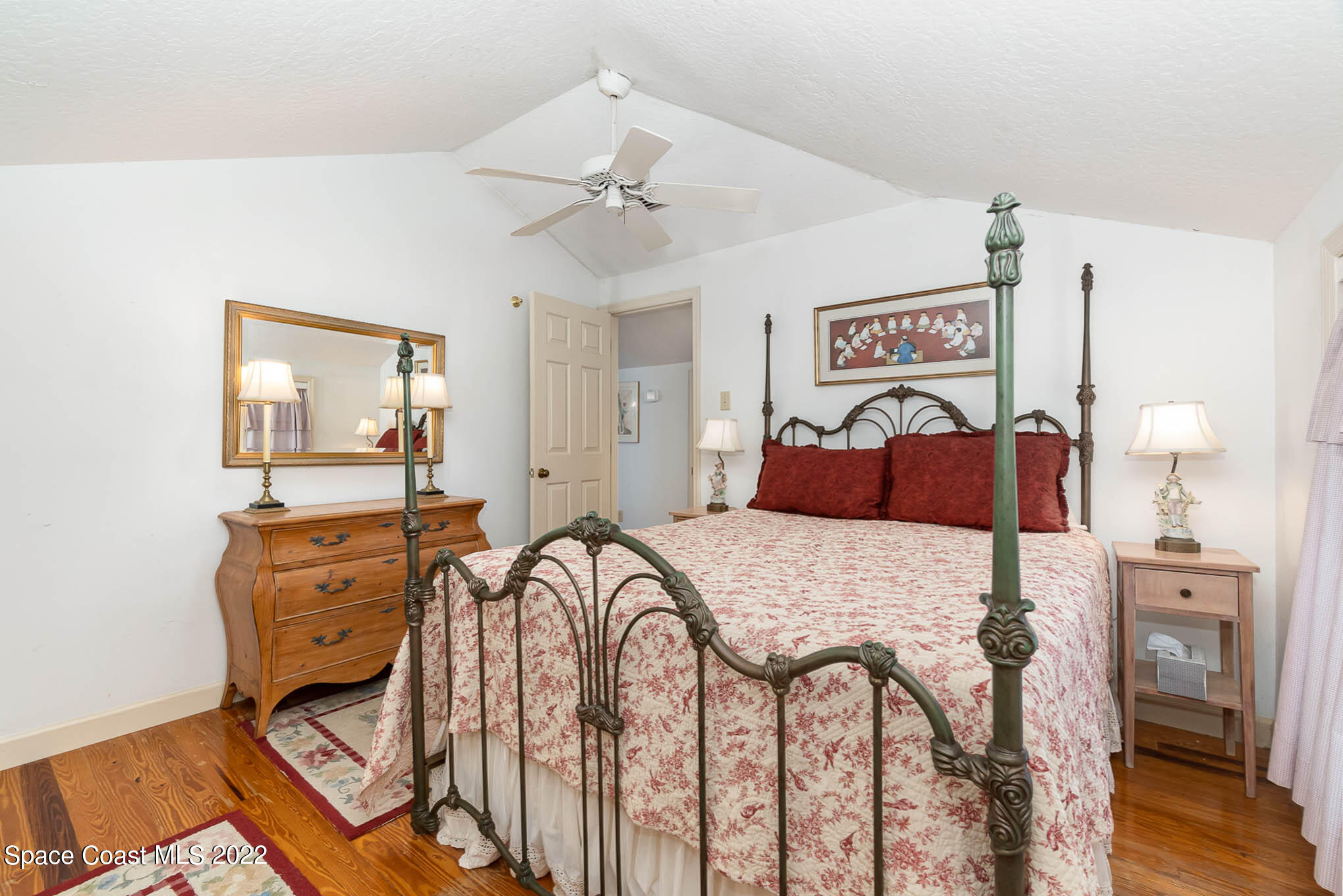 4025 Turtle Mound Road Melbourne, FL 32934 - Photo 46 of 54 a bedroom with a bed and wooden floor