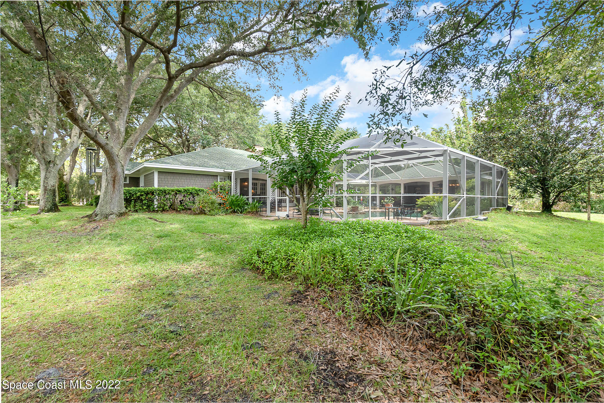 4025 Turtle Mound Road Melbourne, FL 32934 - Photo 48 of 54 a view of a house with a yard