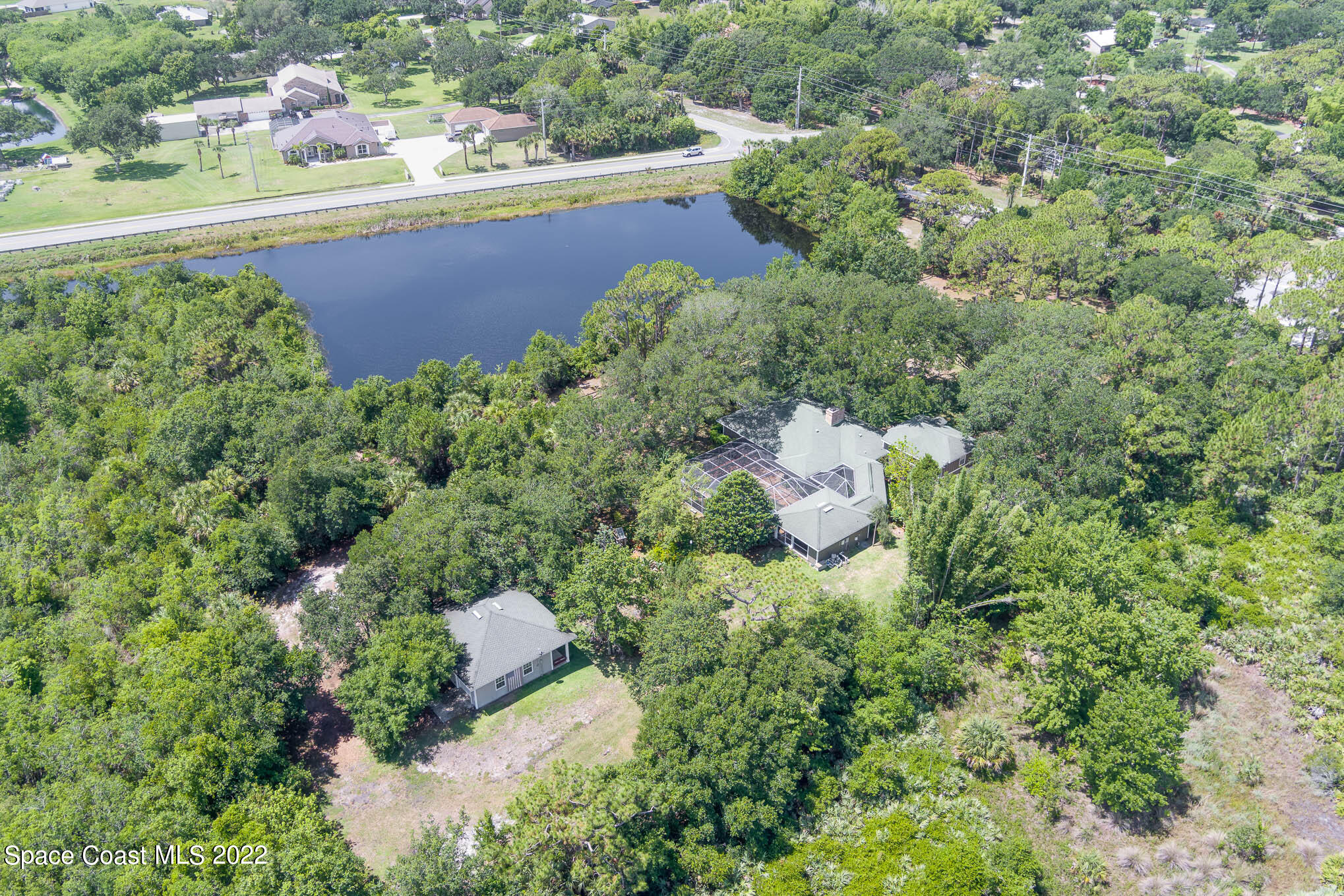 4025 Turtle Mound Road Melbourne, FL 32934 - Photo 50 of 54 an aerial view of a house with a yard and lake view