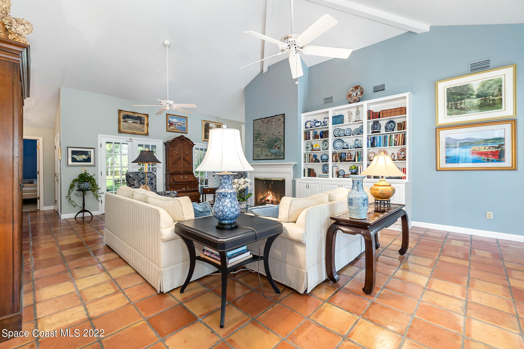4025 Turtle Mound Road Melbourne, FL 32934 - Photo 5 of 54 a living room with fireplace furniture and a table