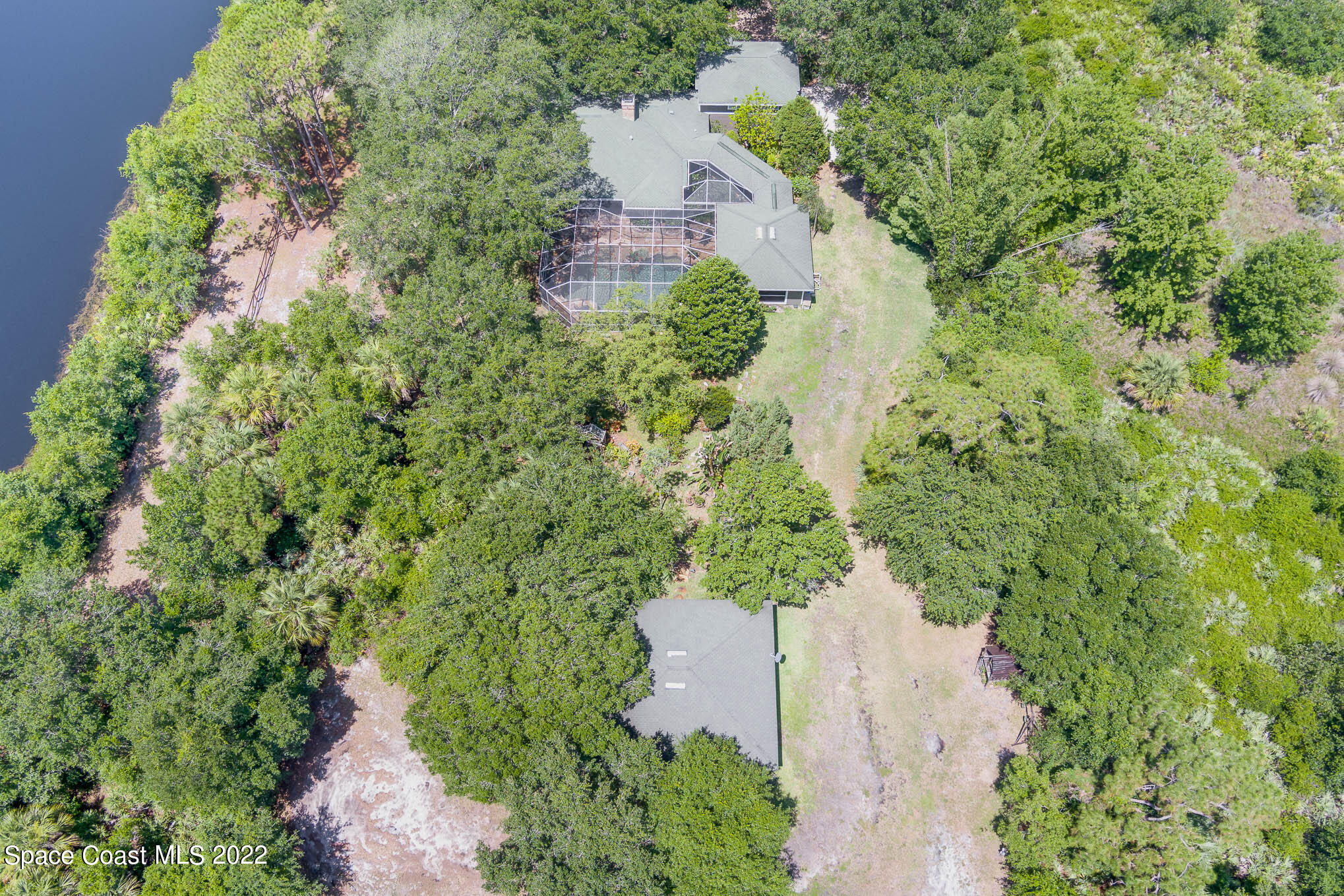 4025 Turtle Mound Road Melbourne, FL 32934 - Photo 51 of 54 an aerial view of a house with a yard