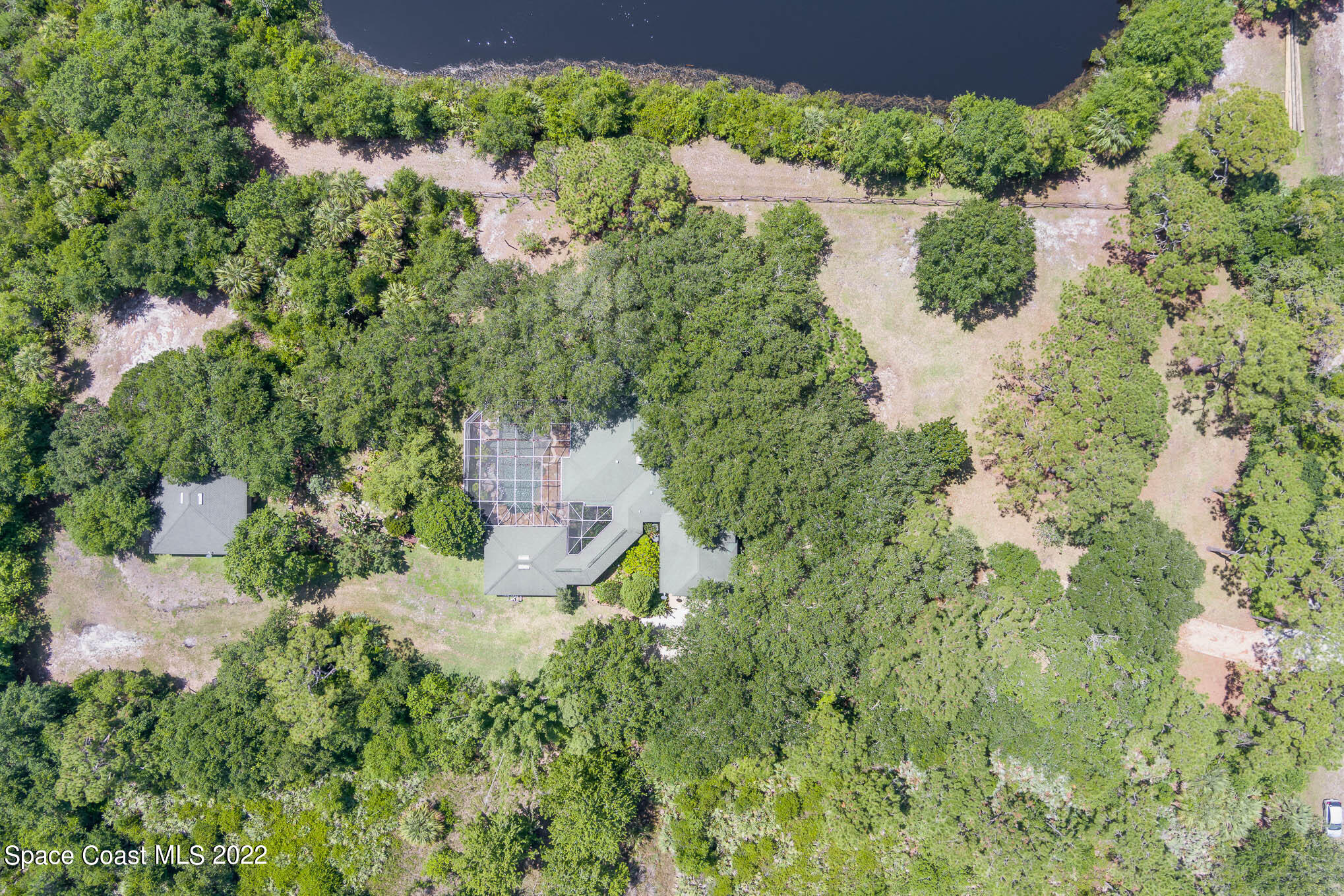 4025 Turtle Mound Road Melbourne, FL 32934 - Photo 54 of 54 an aerial view of residential house with outdoor space and trees all around