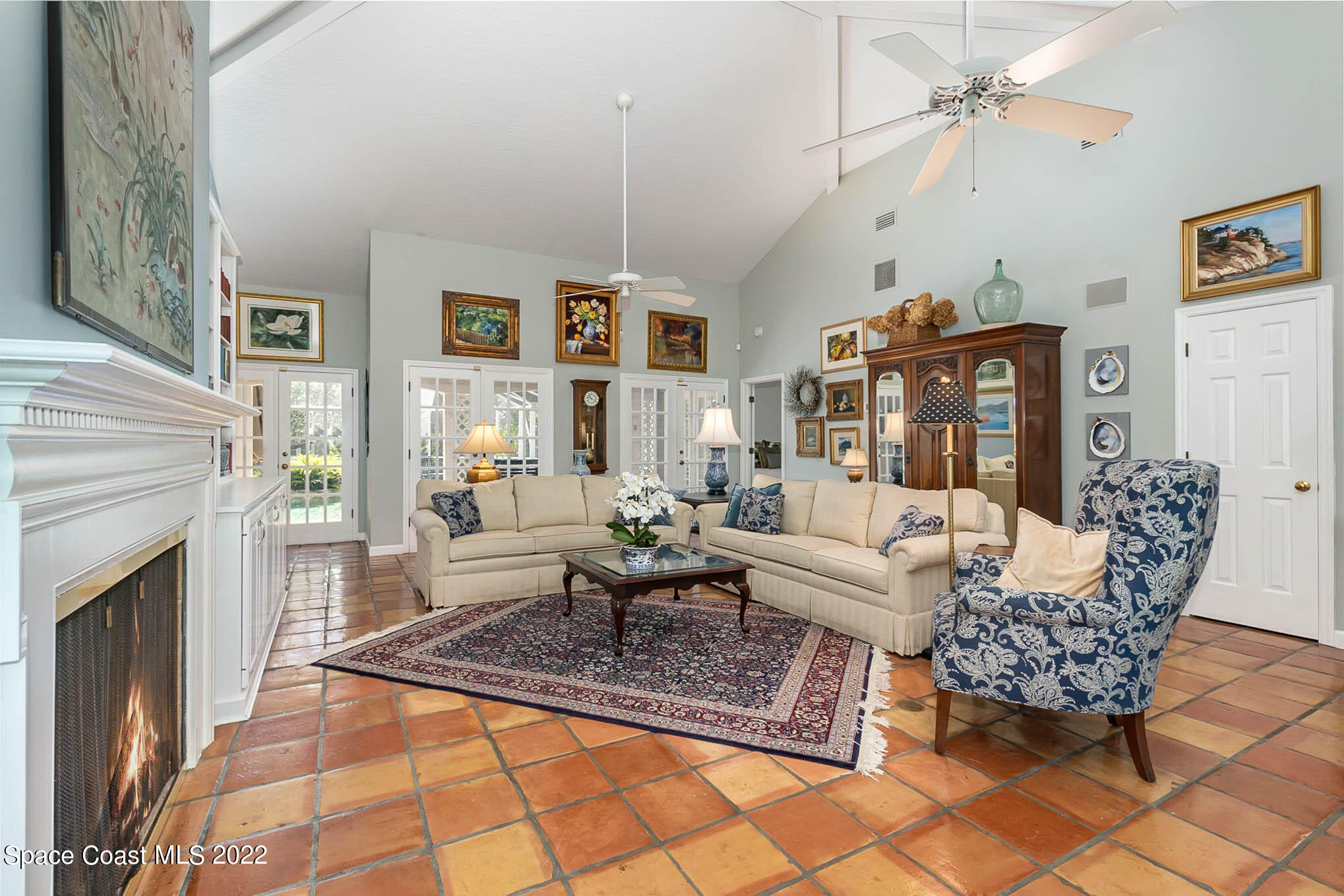 4025 Turtle Mound Road Melbourne, FL 32934 - Photo 6 of 54 a living room with furniture a fireplace and a table