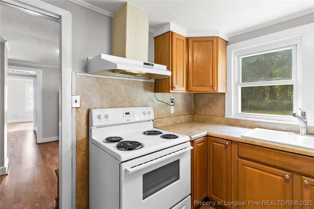 a kitchen with a stove and a refrigerator