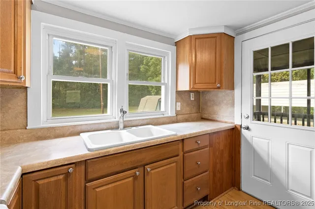 a kitchen with a sink and a window