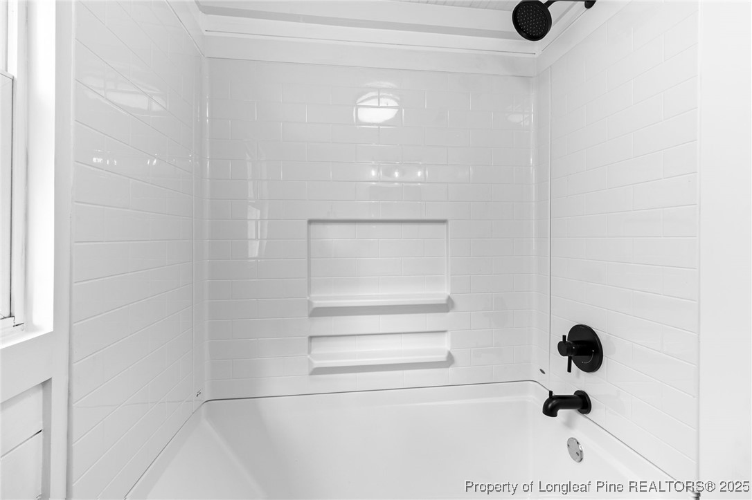 21480 Jane Shaw Road Wagram, NC 28396 - Photo 20 of 31 a bathroom with a shower