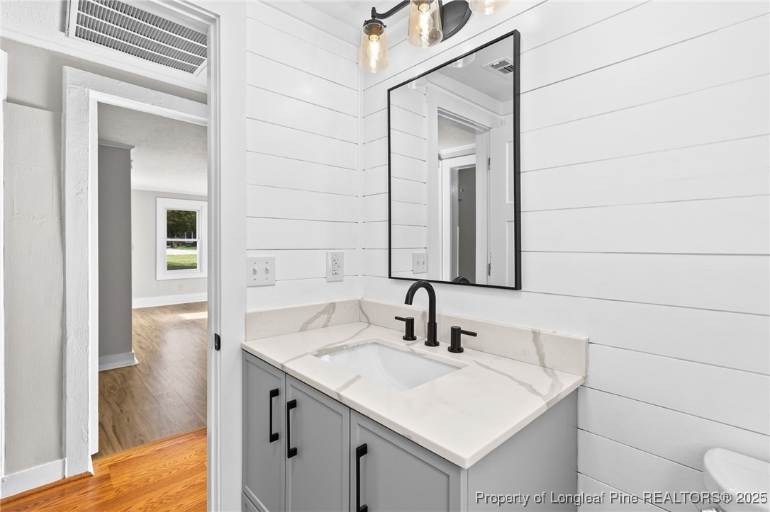 21480 Jane Shaw Road Wagram, NC 28396 - Photo 21 of 31 a bathroom with a sink and a mirror