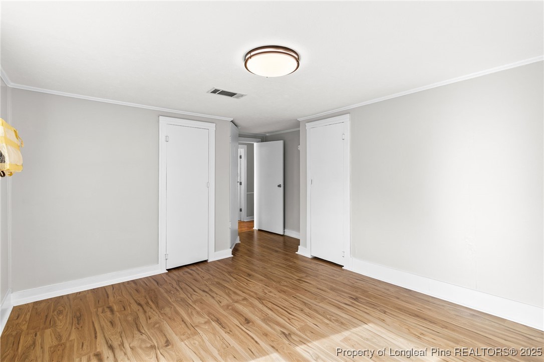 21480 Jane Shaw Road Wagram, NC 28396 - Photo 25 of 31 a view of room with wooden floor and bathroom