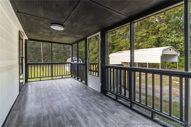 a view of a room with wooden floor and stairs