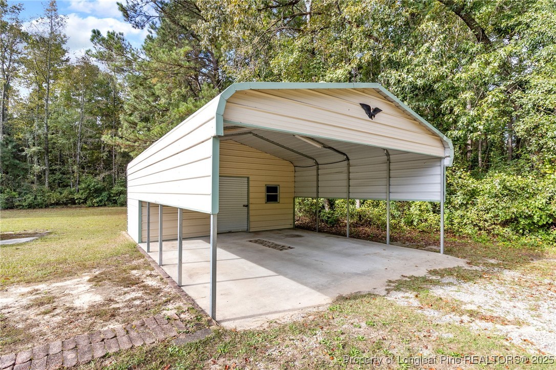 21480 Jane Shaw Road Wagram, NC 28396 - Photo 27 of 31 a view of a house with a yard